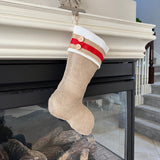 BurlapBabe Christmas stocking with natural burlap, ivory fleece cuff, red ribbon trim, and two wooden buttons.