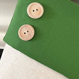 BurlapBabe red and green Christmas stocking featuring neutral fabric and two decorative wooden buttons