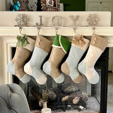 BurlapBabe set of five rustic Christmas stockings featuring green ticking stripes, burlap fabric, and jute loops.