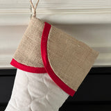 BurlapBabe quilted Christmas stocking with a natural burlap scallop cuff and red cotton trim hanging from a jute loop.