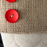 BurlapBabe quilted Christmas stocking featuring natural burlap, cream quilted cotton, and a two bright red wood buttons.