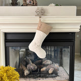 BurlapBabe quilted Christmas stocking with a rustic burlap cuff and two wooden buttons hanging on a fireplace mantel.