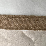 BurlapBabe quilted Christmas stocking featuring a neutral fabric texture and a rustic woven burlap trim detail.