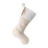 BurlapBabe quilted Christmas stocking in cream fabric with wood buttons and a braided jute hanging loop