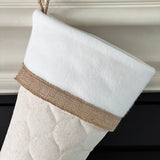 BurlapBabe handmade quilted Christmas stocking in neutral fabric with a white cuff and rustic burlap trim