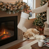 BurlapBabe quilted cream Christmas stocking with a soft fleece cuff hanging by a fireplace with a sleeping dog nearby.