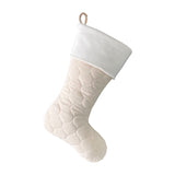 BurlapBabe quilted Christmas stocking in cream fabric with a soft white fleece cuff and braided jute hanging loop.