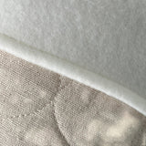 BurlapBabe quilted stocking featuring a soft cream fleece cuff and textured beige quilted fabric detail.