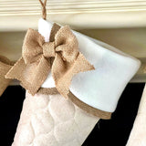 BurlapBabe quilted Christmas stocking with a white fleece scallop cuff and a rustic natural burlap bow detail.
