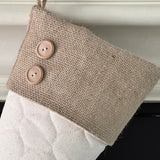 BurlapBabe quilted Christmas stocking with a rustic burlap cuff and two wooden buttons hanging by a jute loop.