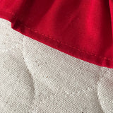 BurlapBabe quilted Christmas stocking detail featuring textured off-white fabric and a bright red cotton ruffle cuff.