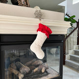 BurlapBabe quilted white Christmas stocking with a red cotton ruffle cuff hanging from a fireplace mantel