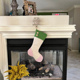 BurlapBabe red and green Christmas stocking with neutral fabric, wooden buttons, and a braided jute hanging loop.