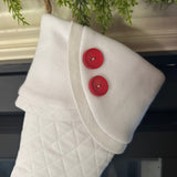 BurlapBabe white quilted Christmas stocking with fleece scalloped cuff, white trim, and two red wooden buttons.